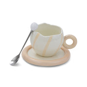 Cracked & striped mug on a plate