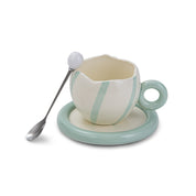 Cracked & striped mug on a plate