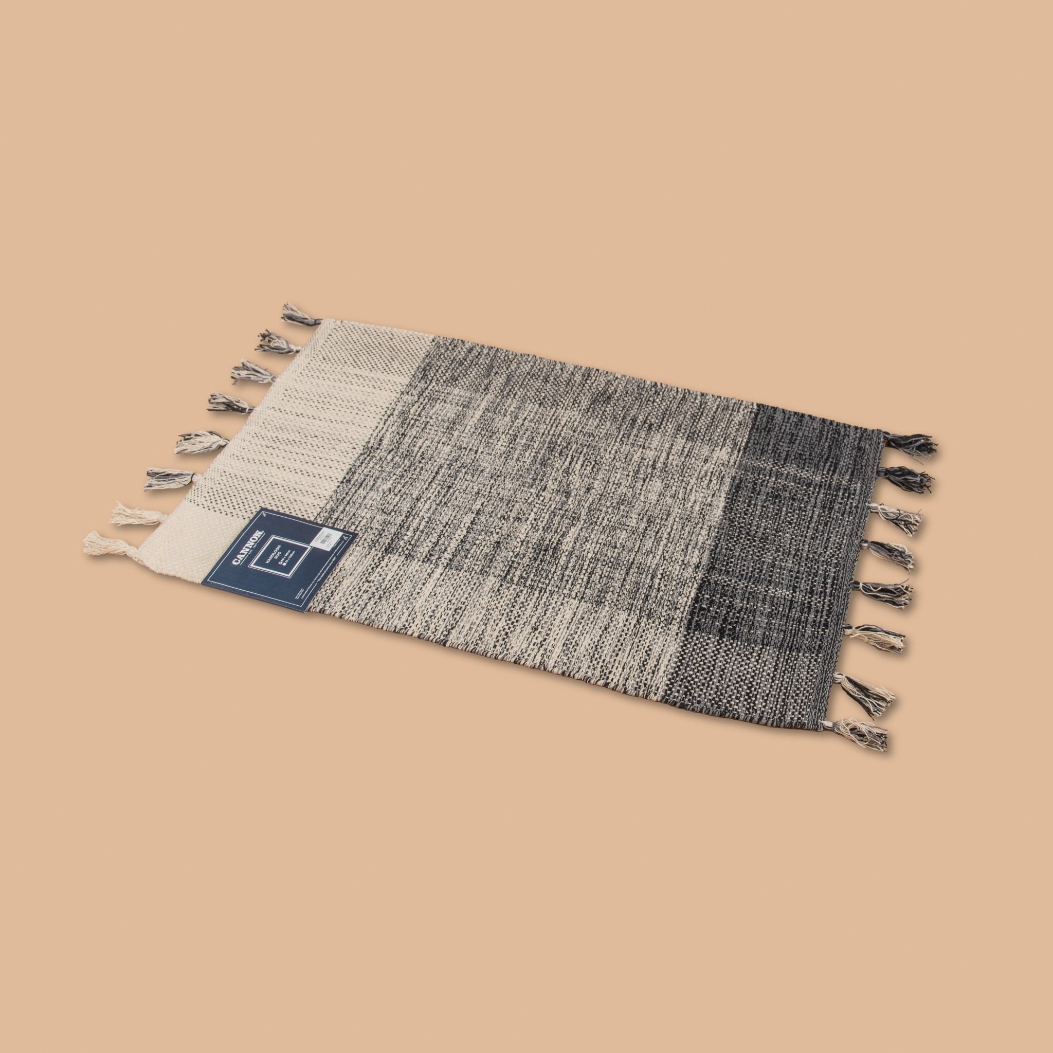 Cannon Rug 60×90 cm – 100% Cotton Handloom with Tassels (Black) - Urban Home