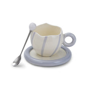 Cracked & striped mug on a plate